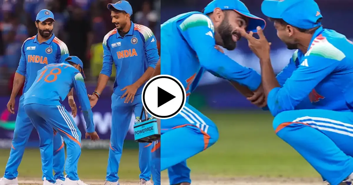 virat kohli playfully touches axar patel feet